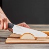 Kyocera Advanced Ceramic Revolution Series 7-inch Professional Chef's Knife Black Handle White Blade